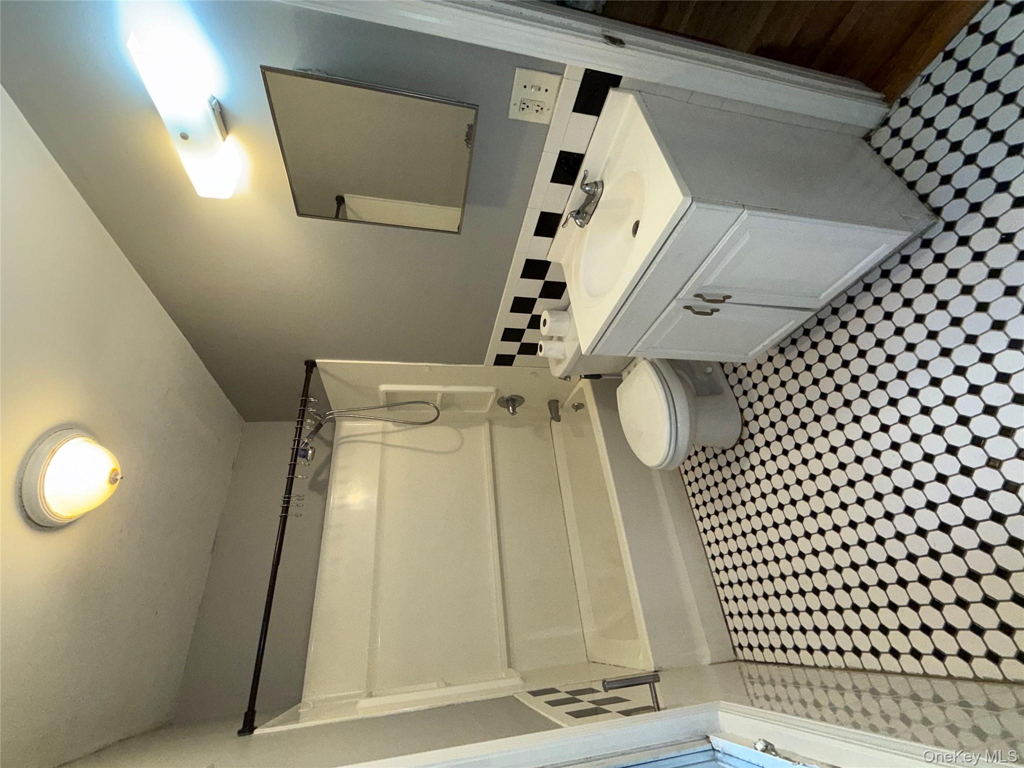 54 Gifford Avenue, Unit 2 Poughkeepsie, NY 12601 - Photo 14 of 19 a bathroom with a sink a toilet and a shower