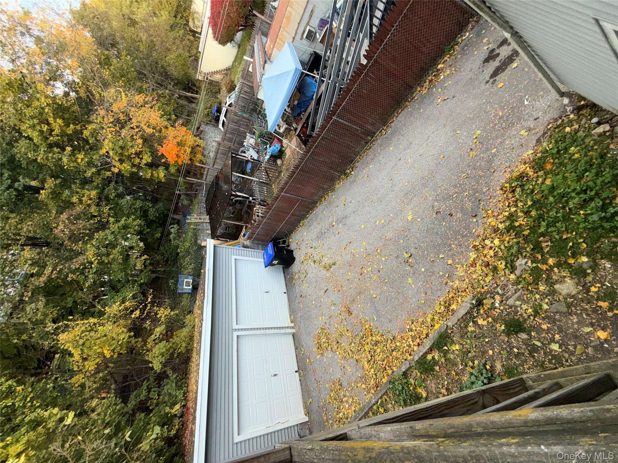54 Gifford Avenue, Unit 2 Poughkeepsie, NY 12601 - Photo 19 of 19 a view of a backyard with trees
