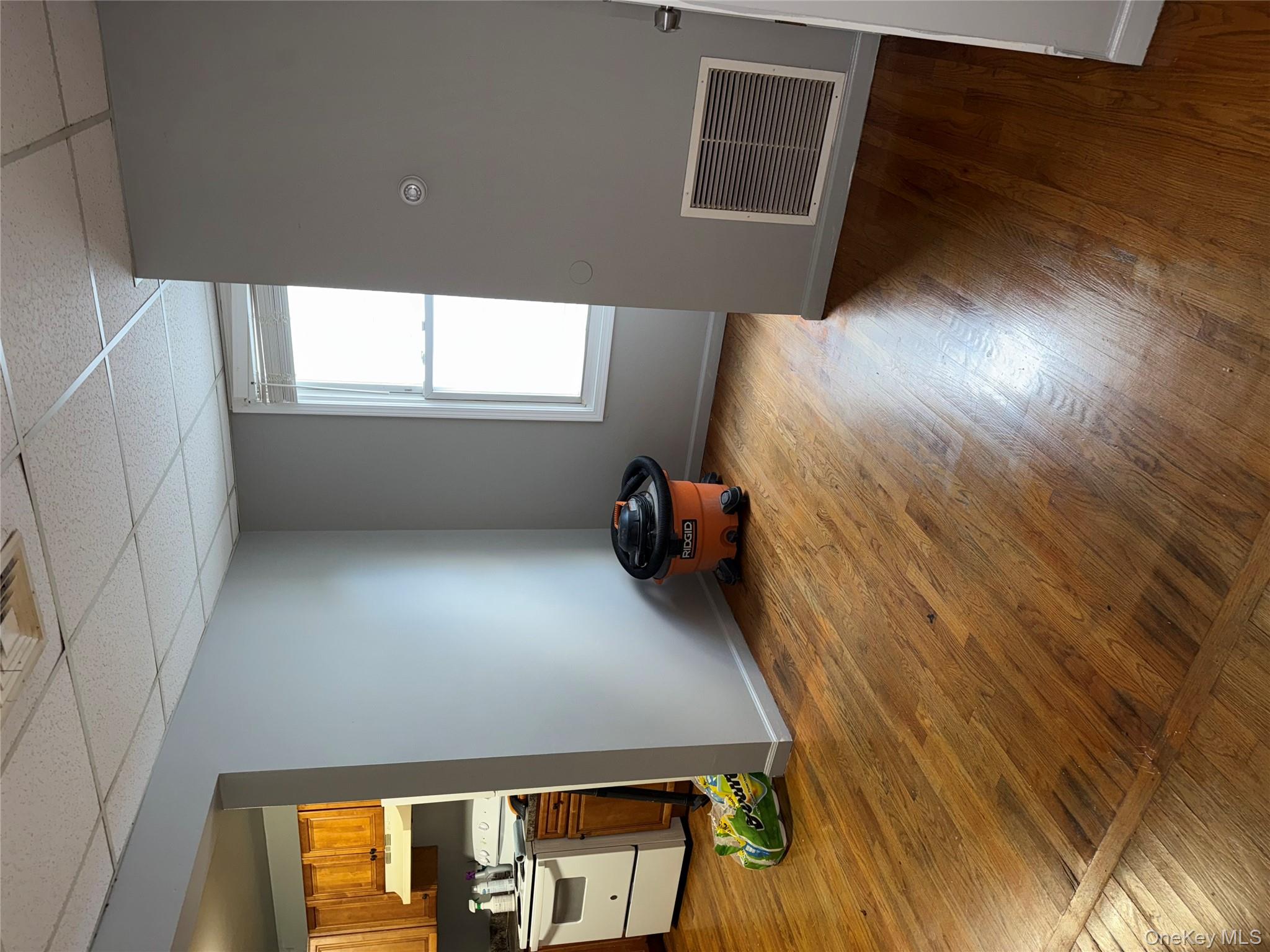 54 Gifford Avenue, Unit 2 Poughkeepsie, NY 12601 - Photo 6 of 19 a view of empty room with wooden floor and fan