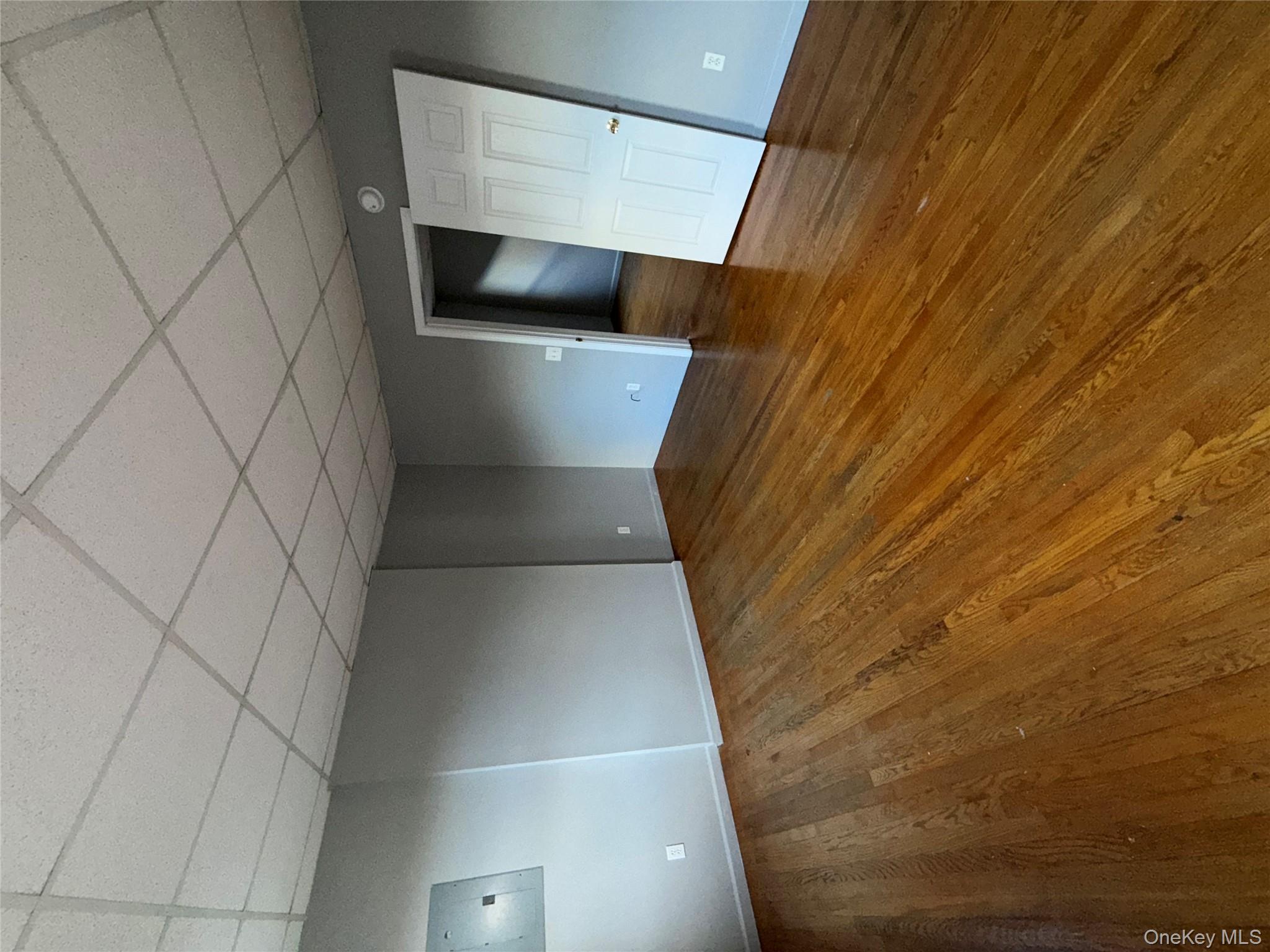 54 Gifford Avenue, Unit 2 Poughkeepsie, NY 12601 - Photo 7 of 19 a view of empty room with wooden floor