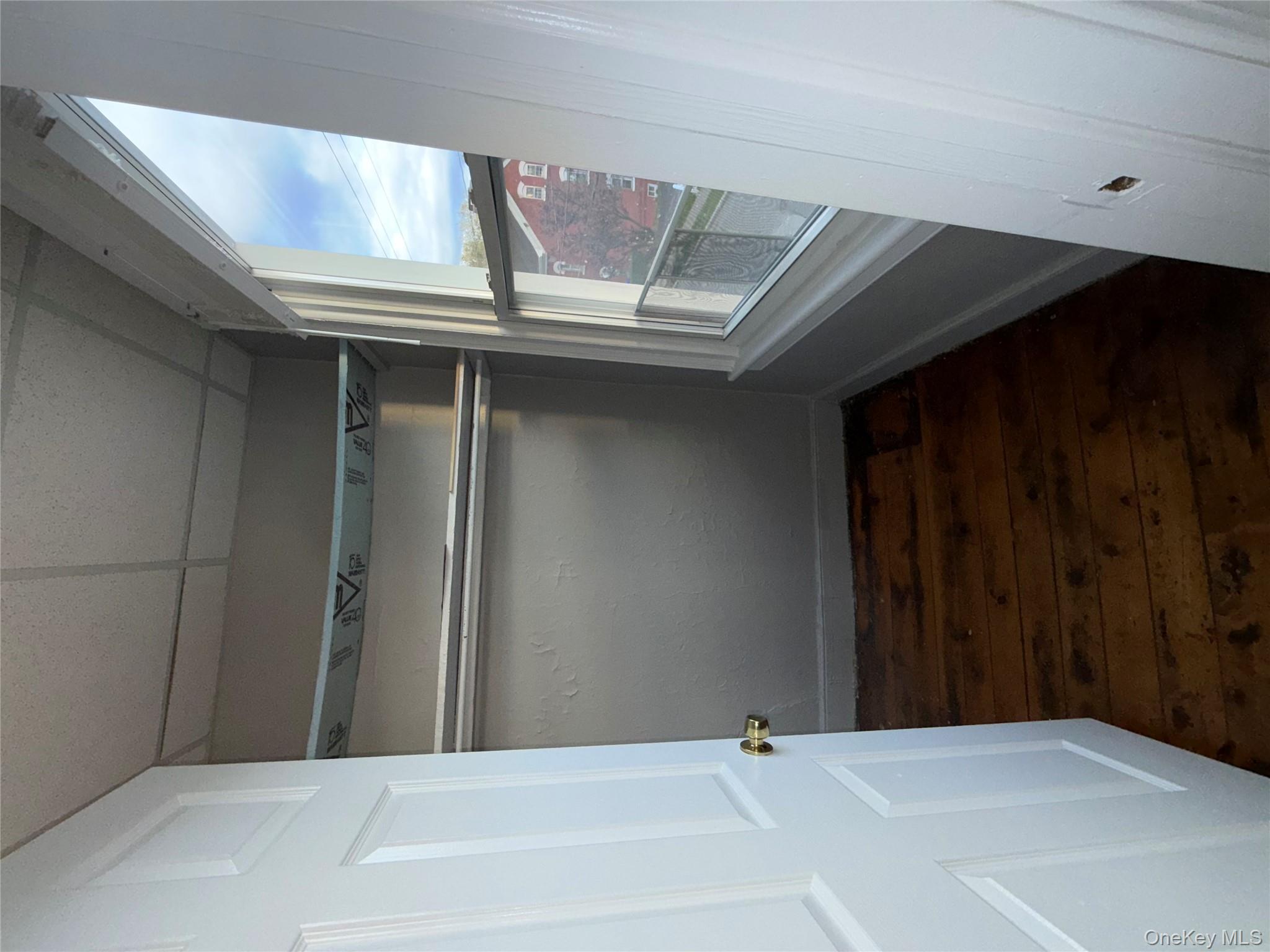 54 Gifford Avenue, Unit 2 Poughkeepsie, NY 12601 - Photo 9 of 19 a view of empty room with wooden floor and fan