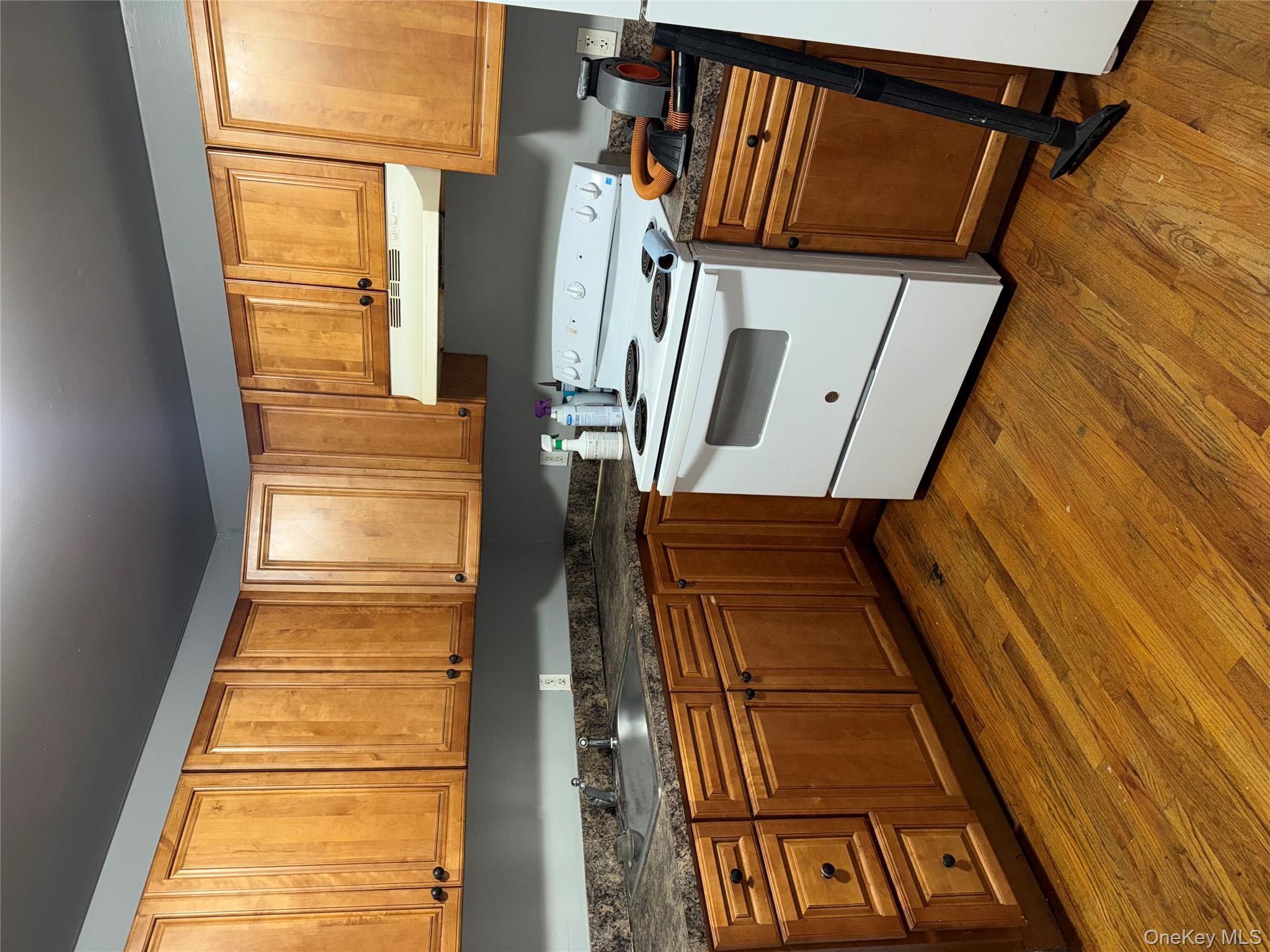 54 Gifford Avenue, Unit 2 Poughkeepsie, NY 12601 - Photo 10 of 19 a kitchen with a stove a sink and a microwave