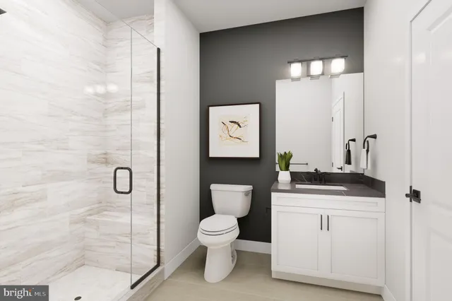 a bedroom with a bed lamp and window