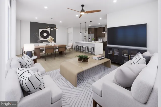 a kitchen with stainless steel appliances granite countertop a refrigerator a sink and a oven