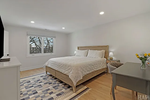 a room with a bed and a flat screen tv