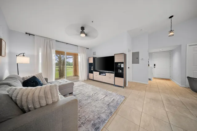 a bedroom with a bed and a refrigerator