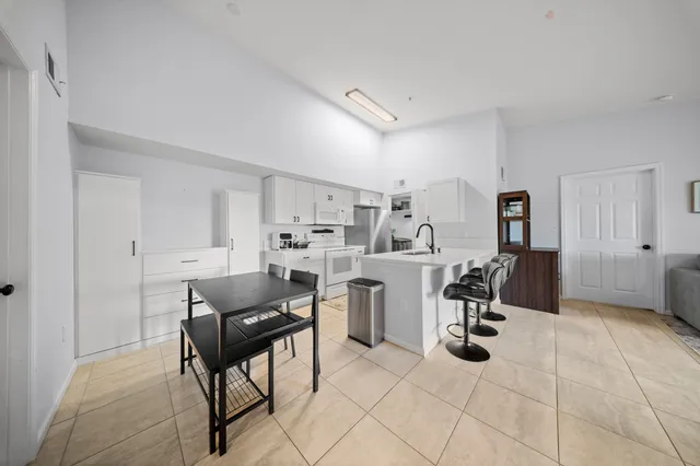 a kitchen with a sink appliances and cabinets