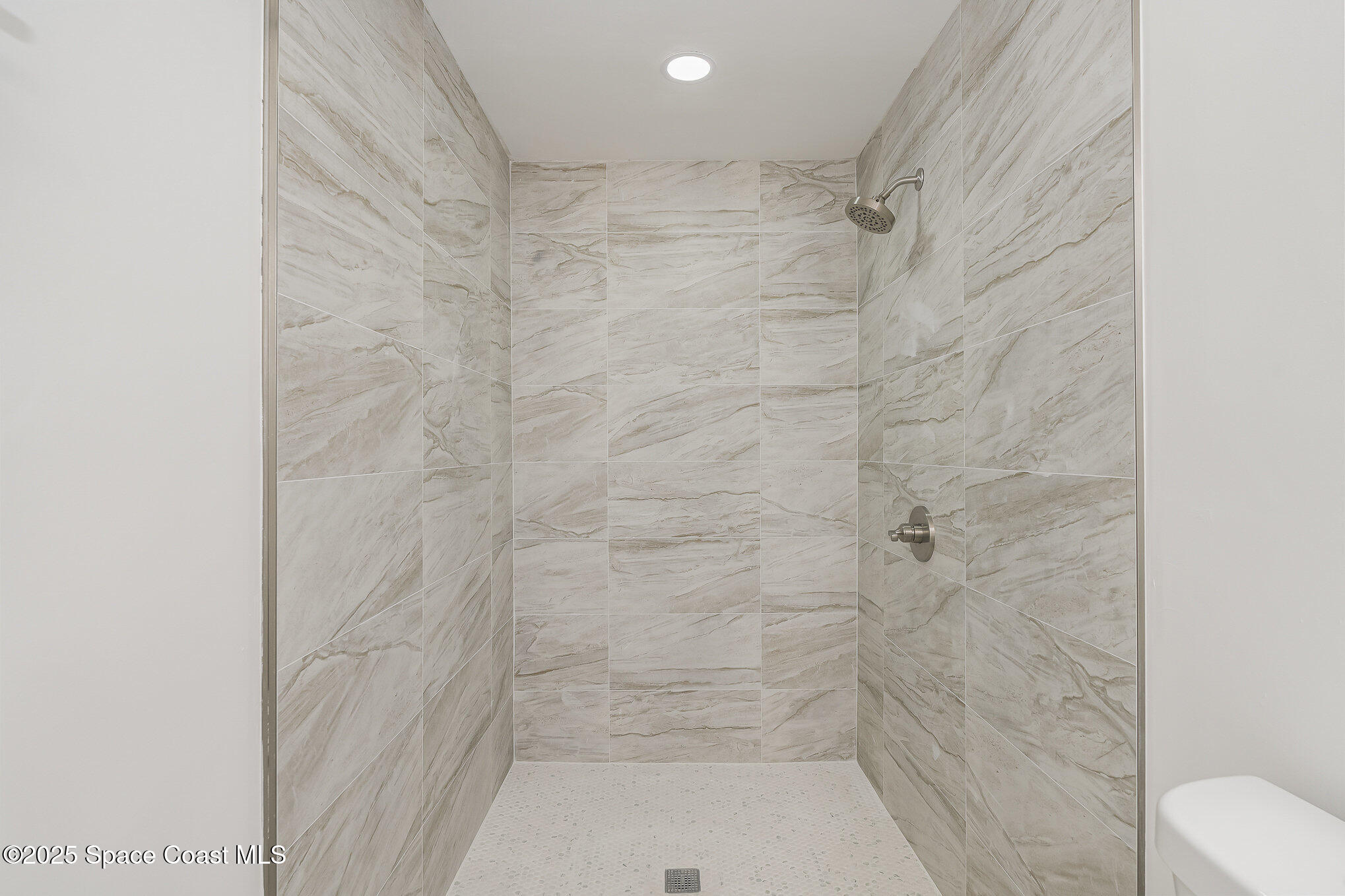 906 Kings Post Road Rockledge, FL 32955 - Photo 12 of 31 a bathroom with a shower
