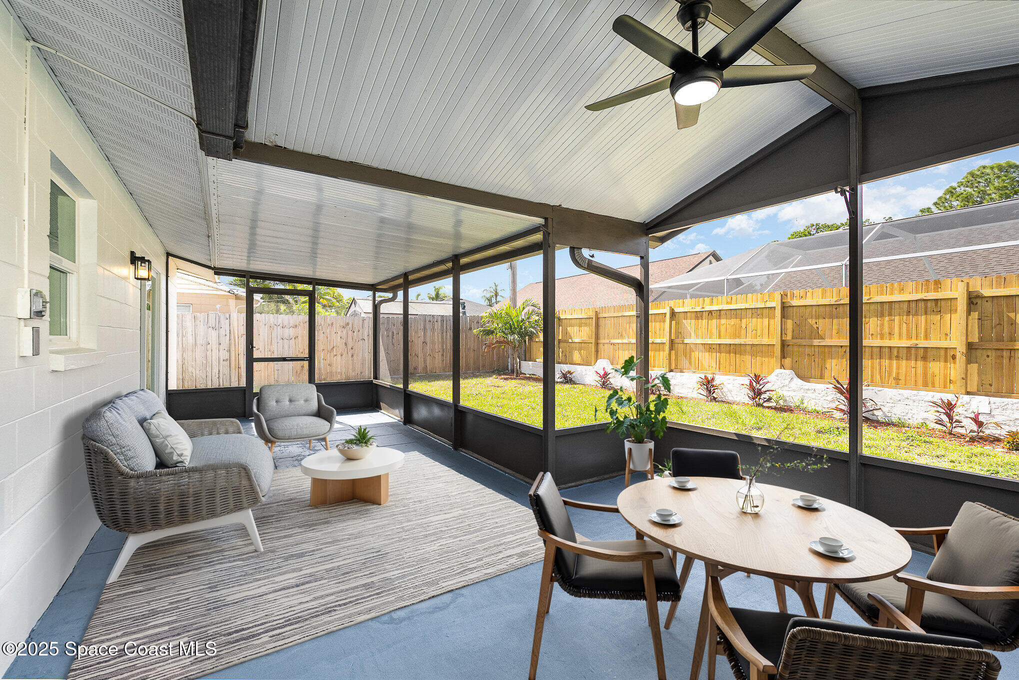 906 Kings Post Road Rockledge, FL 32955 - Photo 24 of 31 a living room with furniture and a large window
