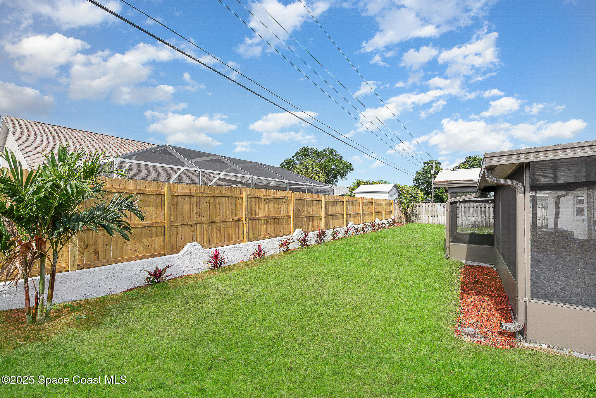 906 Kings Post Road Rockledge, FL 32955 - Photo 27 of 31 a view of a backyard with trampoline