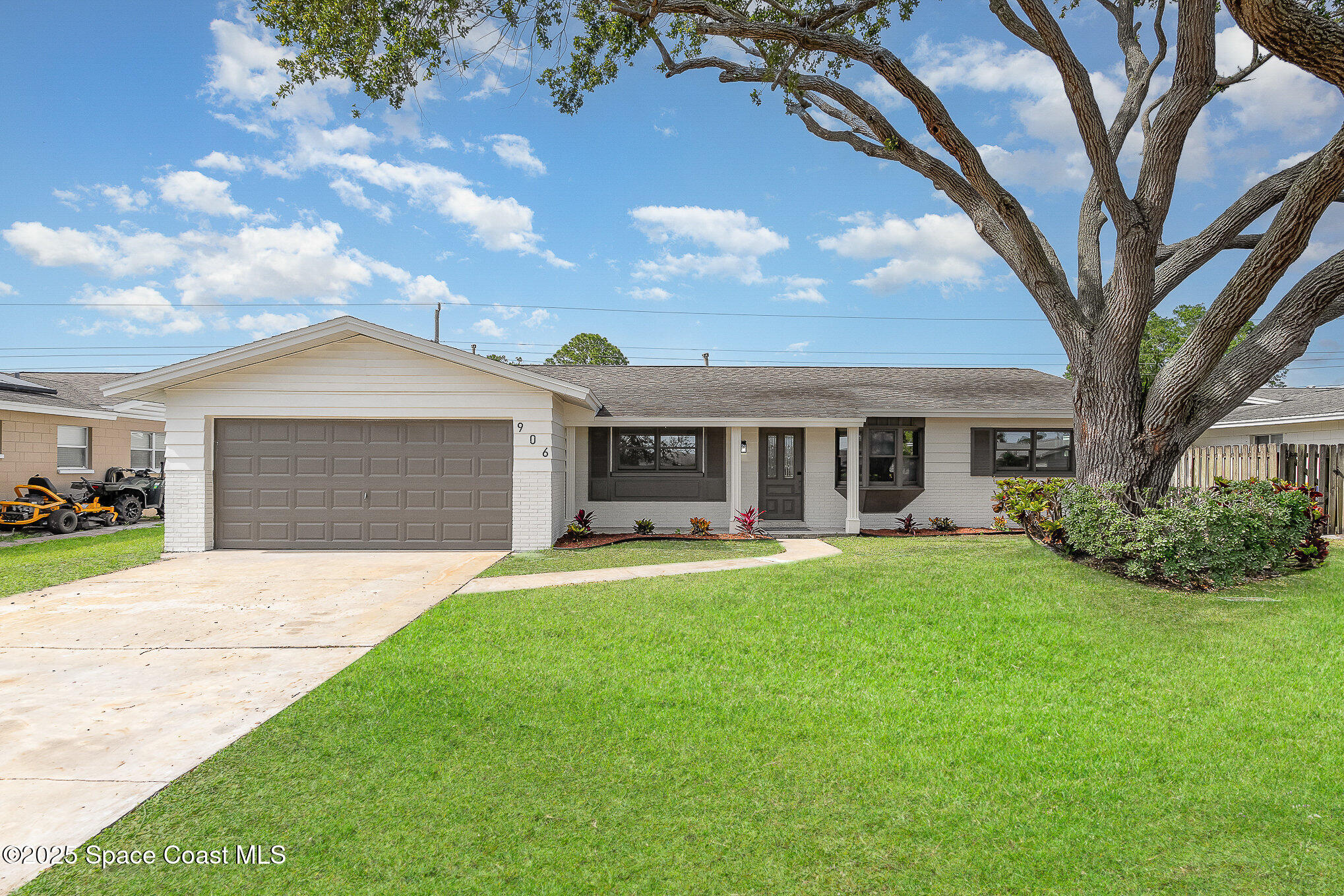 906 Kings Post Road Rockledge, FL 32955 - Photo 31 of 31 a front view of a house with garden and porch