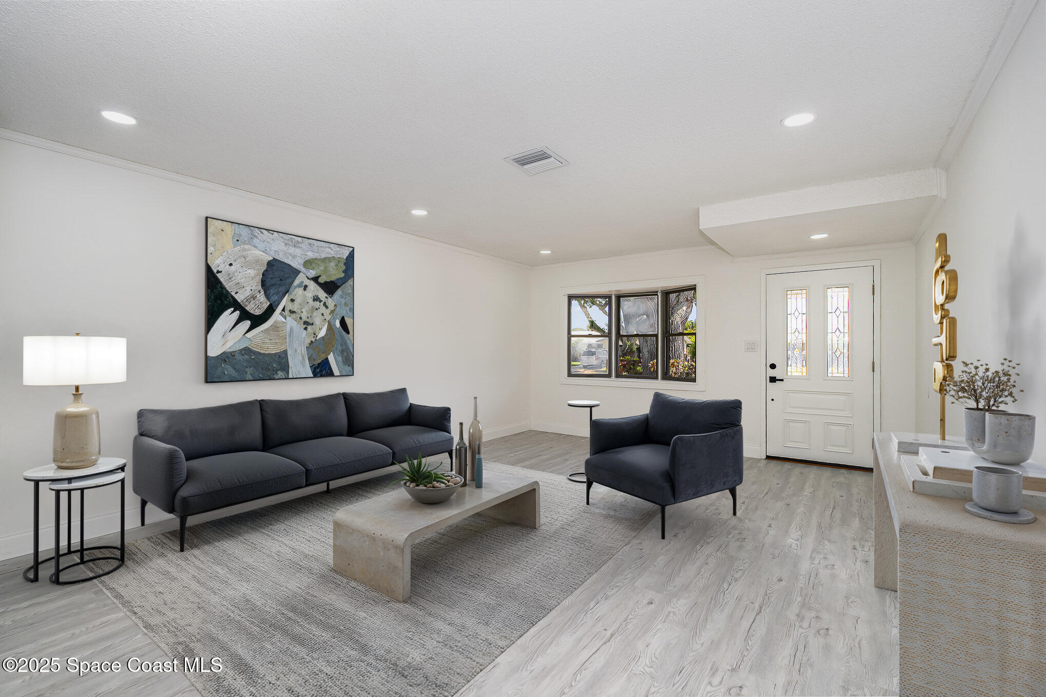 906 Kings Post Road Rockledge, FL 32955 - Photo 7 of 31 a living room with furniture and a couch