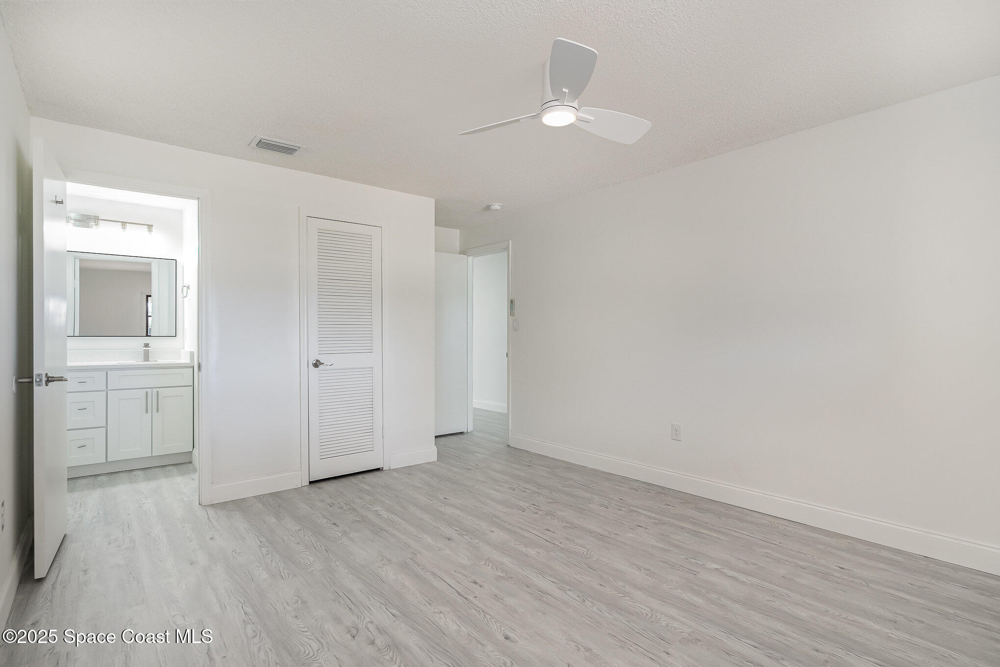 906 Kings Post Road Rockledge, FL 32955 - Photo 10 of 31 wooden floor in an empty room