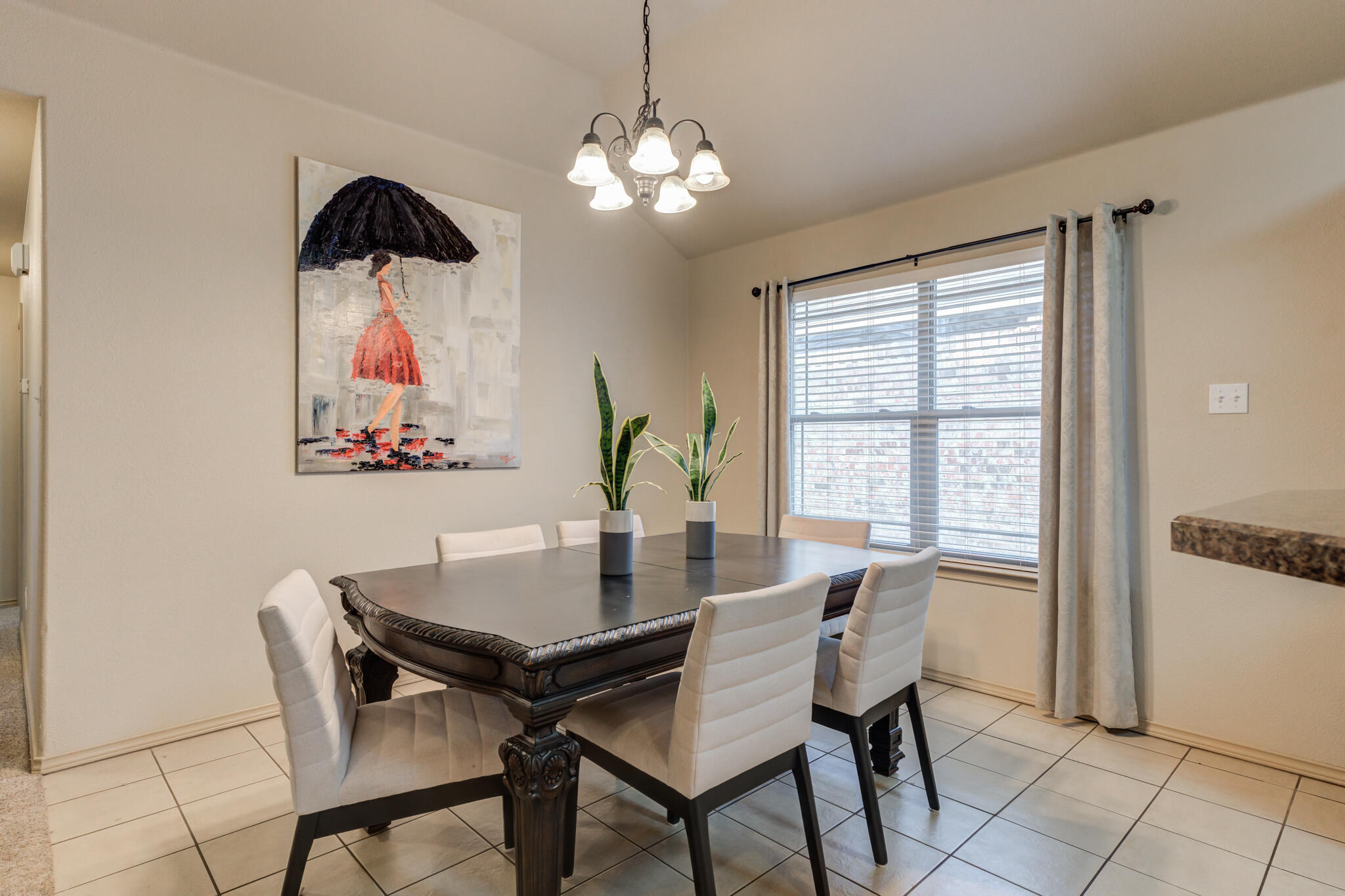 2206 101st Street Lubbock, TX 79423 - Photo 13 of 37 a view of a dining room with furniture window and outside view