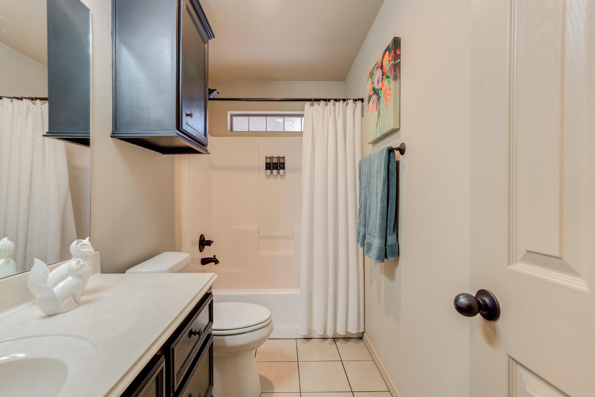 2206 101st Street Lubbock, TX 79423 - Photo 29 of 37 a bathroom with a toilet and a shower