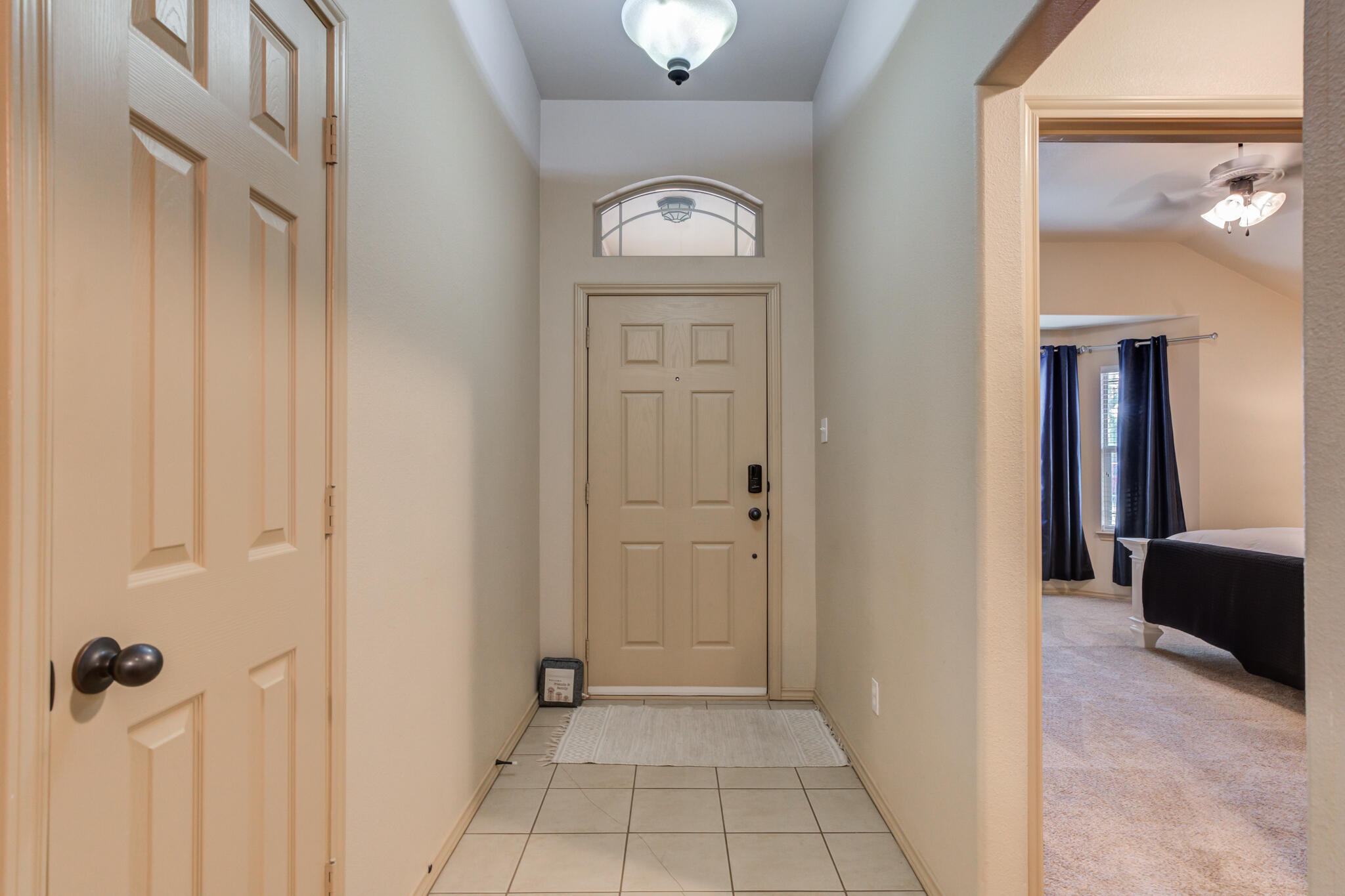 2206 101st Street Lubbock, TX 79423 - Photo 4 of 37 a view of a hallway with wooden floor
