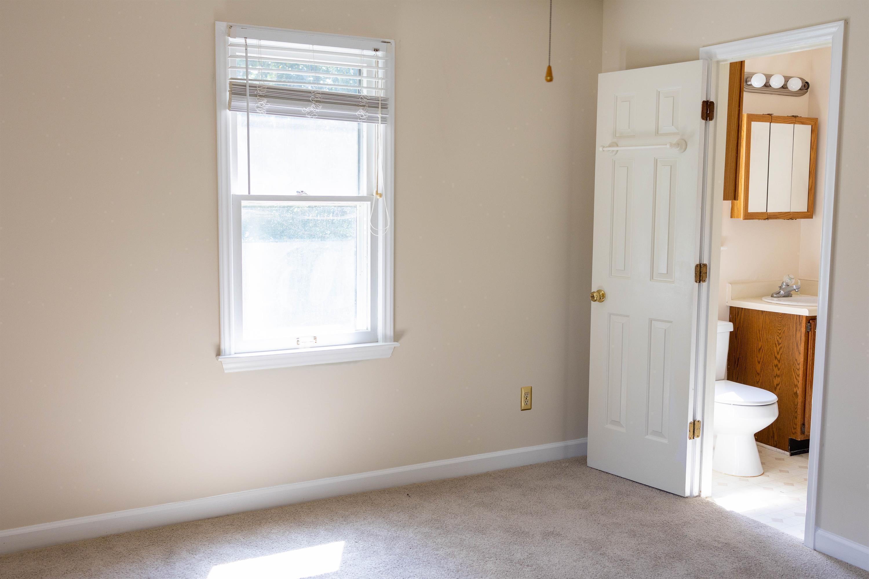 2704 Moorsfield Court Raleigh, NC 27604 - Photo 17 of 25 a bathroom with a toilet