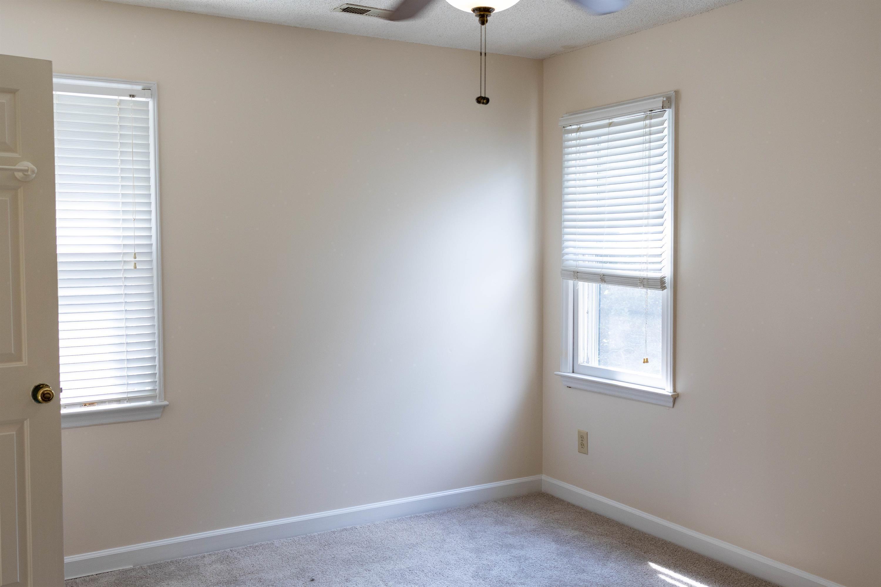 2704 Moorsfield Court Raleigh, NC 27604 - Photo 20 of 25 an empty room with windows