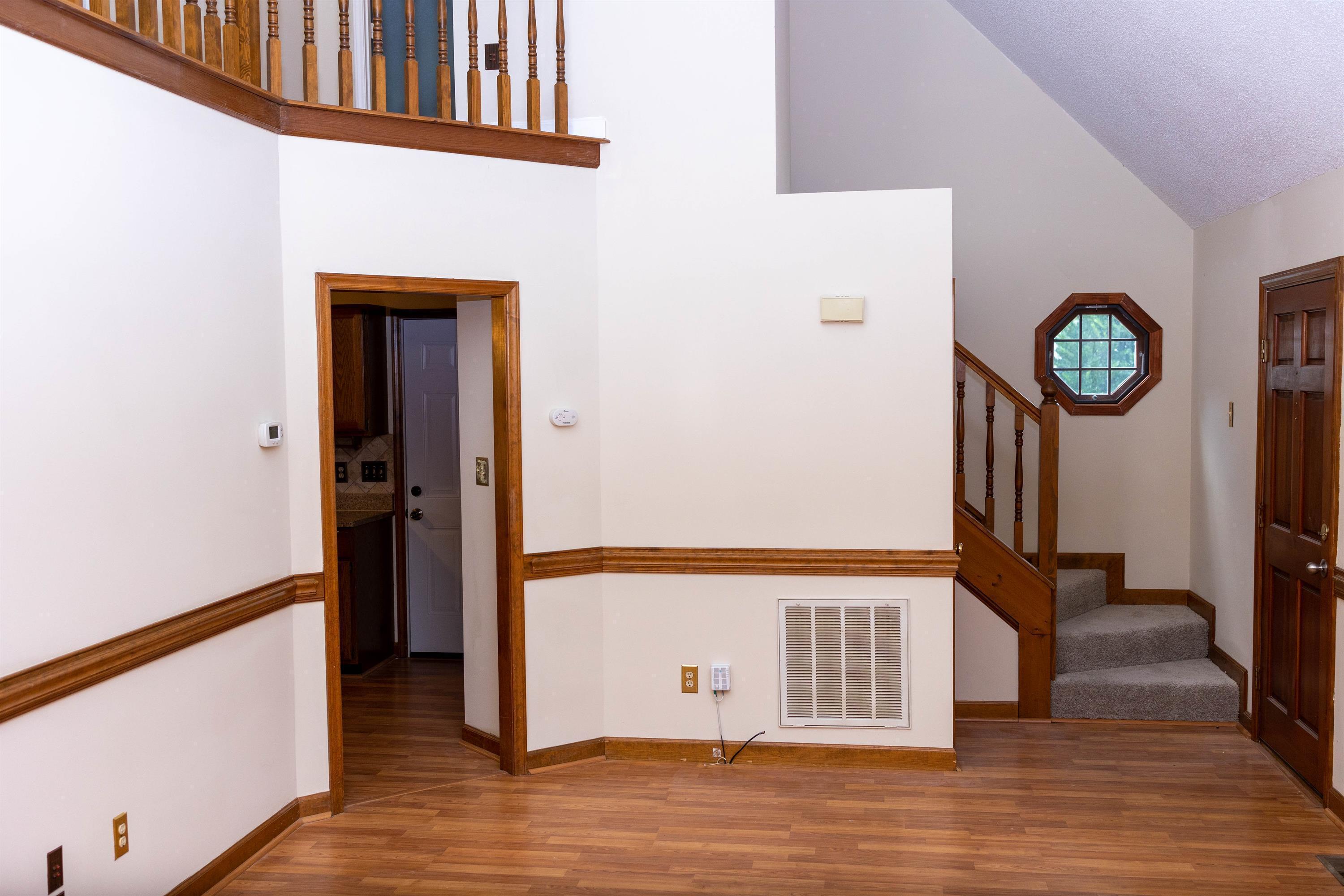 2704 Moorsfield Court Raleigh, NC 27604 - Photo 2 of 25 a view of a hallway with wooden floor