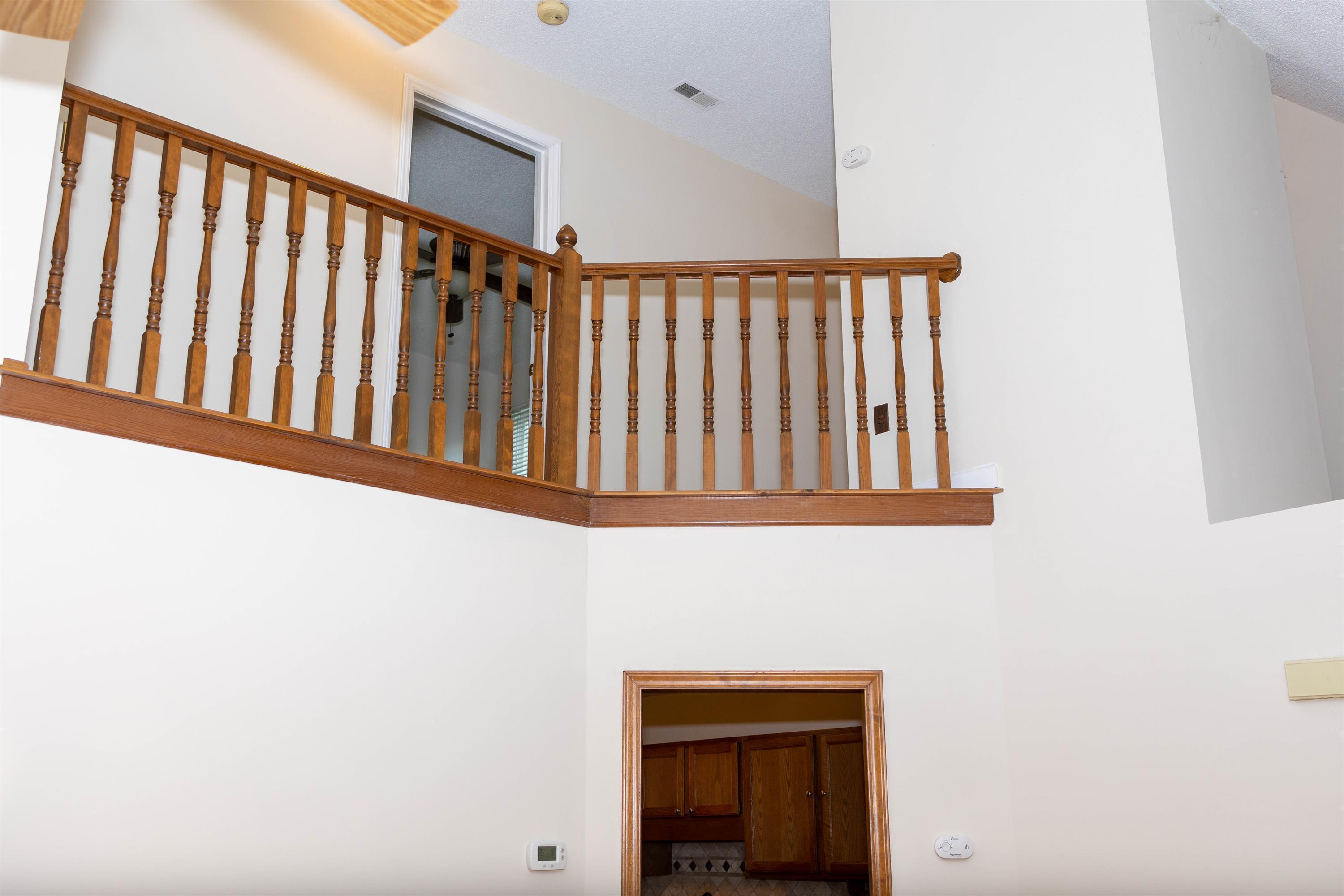 2704 Moorsfield Court Raleigh, NC 27604 - Photo 4 of 25 a view of staircase with railing and a window