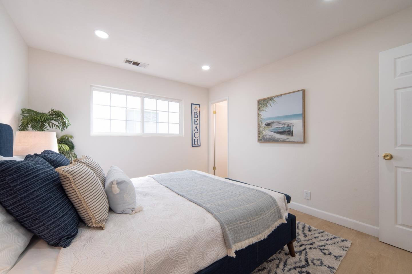 8567 Galindo Drive Dublin, CA 94568 - Photo 11 of 41 a bedroom with a large bed and a window