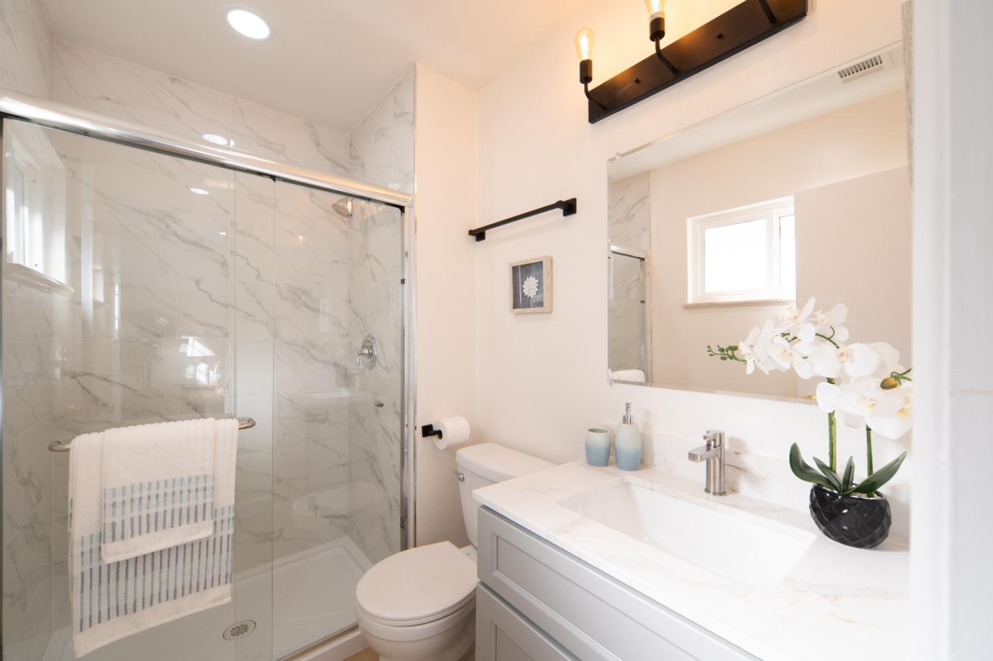 8567 Galindo Drive Dublin, CA 94568 - Photo 12 of 41 a bathroom with a sink a toilet and shower