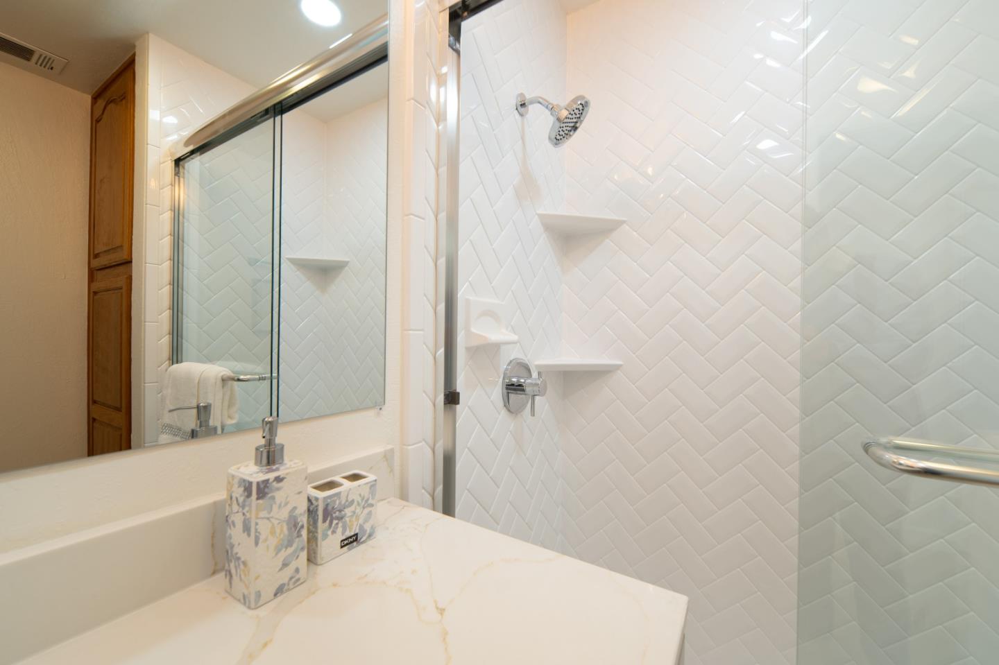 8567 Galindo Drive Dublin, CA 94568 - Photo 16 of 41 a bathroom with a white tub shower vanity and a sink