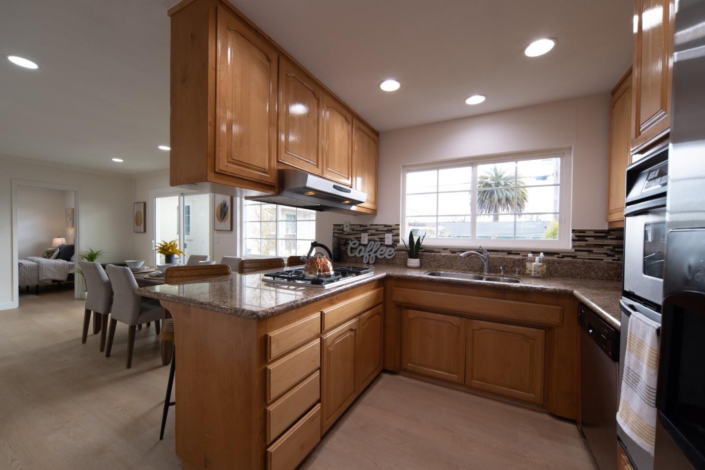 8567 Galindo Drive Dublin, CA 94568 - Photo 25 of 41 a kitchen with a sink stove and cabinets