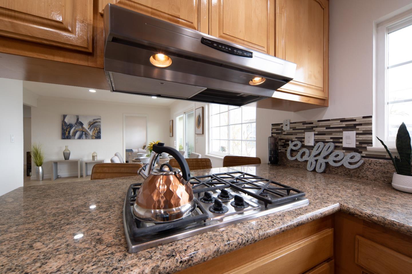 8567 Galindo Drive Dublin, CA 94568 - Photo 27 of 41 a kitchen with a stove and a wooden floor