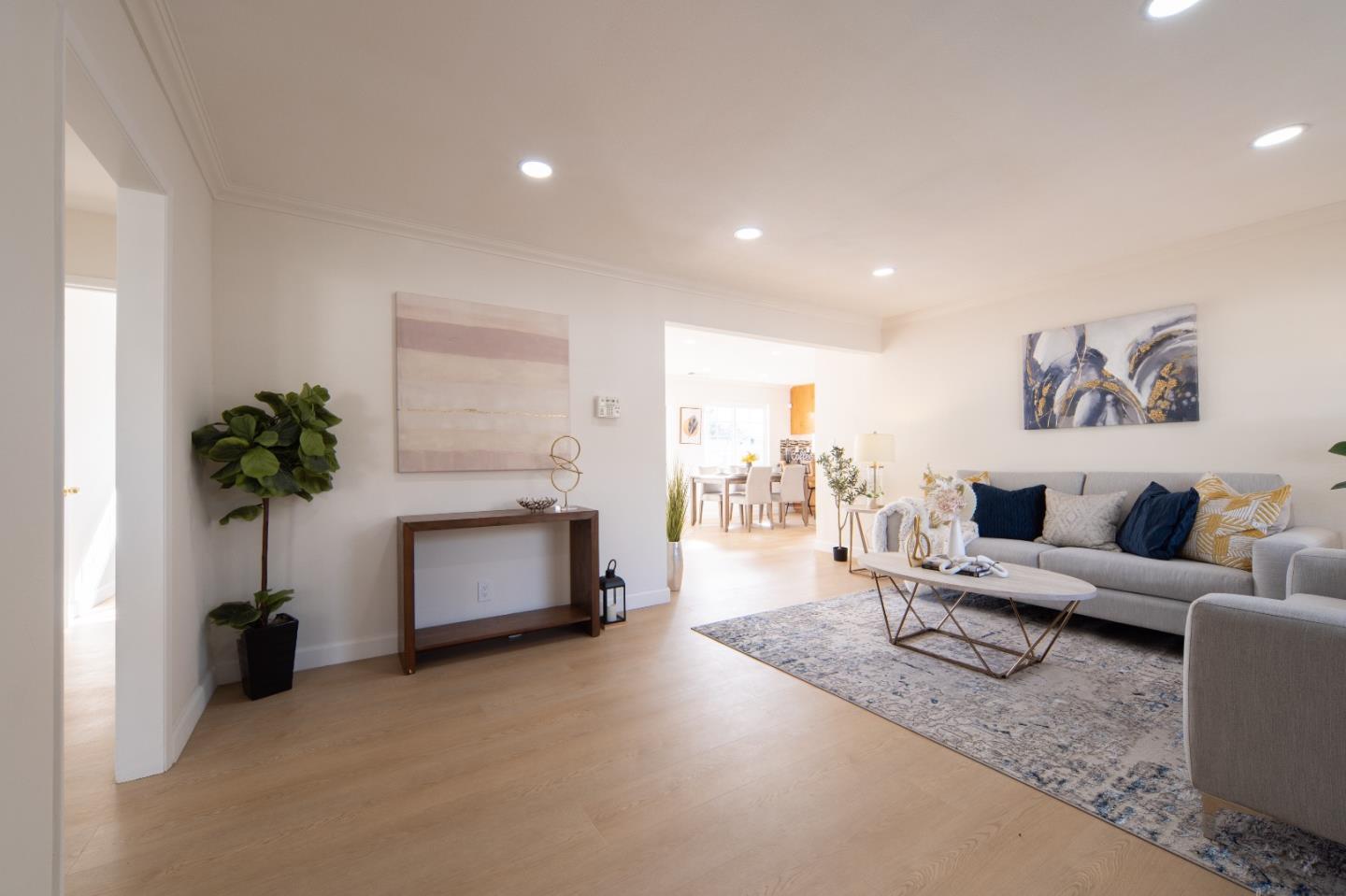 8567 Galindo Drive Dublin, CA 94568 - Photo 5 of 41 a living room with furniture and a potted plant