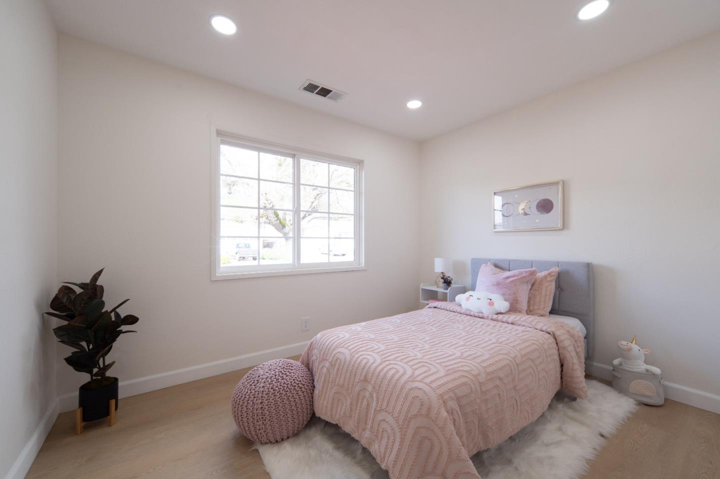 8567 Galindo Drive Dublin, CA 94568 - Photo 6 of 41 a bedroom with a bed and a window