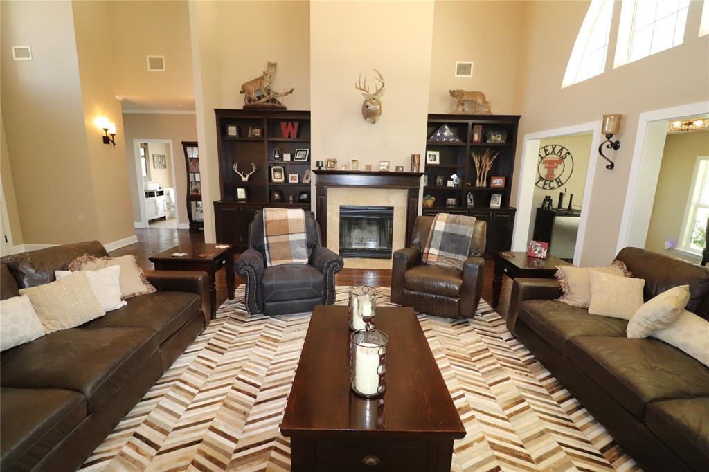 2642 Huddleston Road Sunset, TX 76270 - Photo 12 of 40 a living room with furniture fireplace and flat screen tv