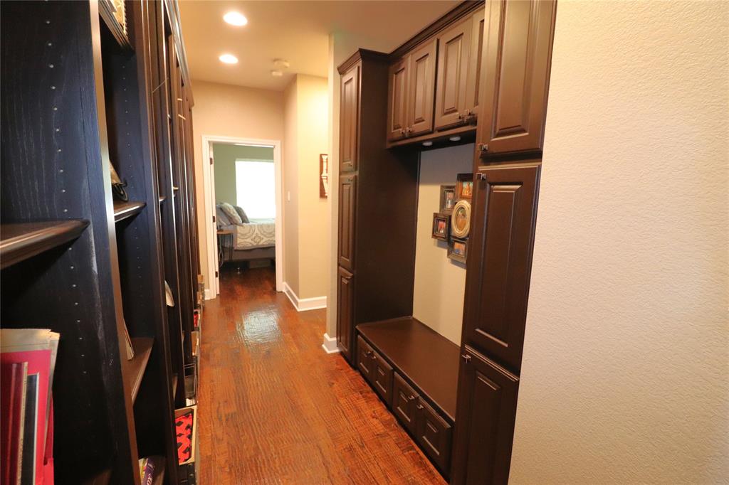 2642 Huddleston Road Sunset, TX 76270 - Photo 19 of 40 a view of a hallway with wooden floor