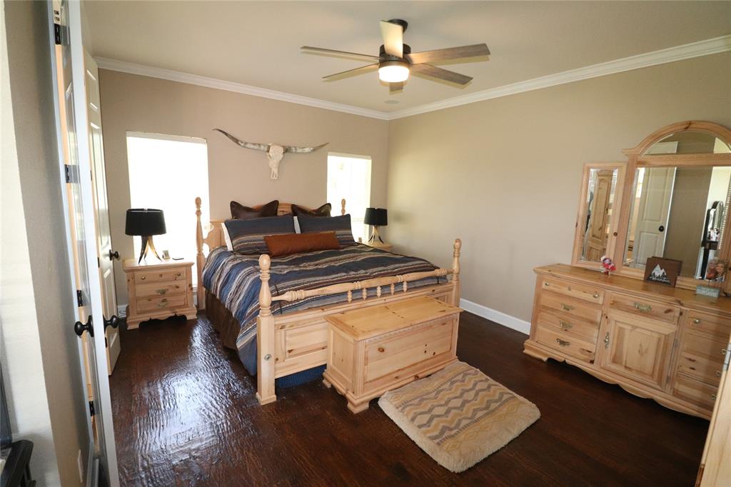 2642 Huddleston Road Sunset, TX 76270 - Photo 25 of 40 a bedroom with a bed dresser and a window