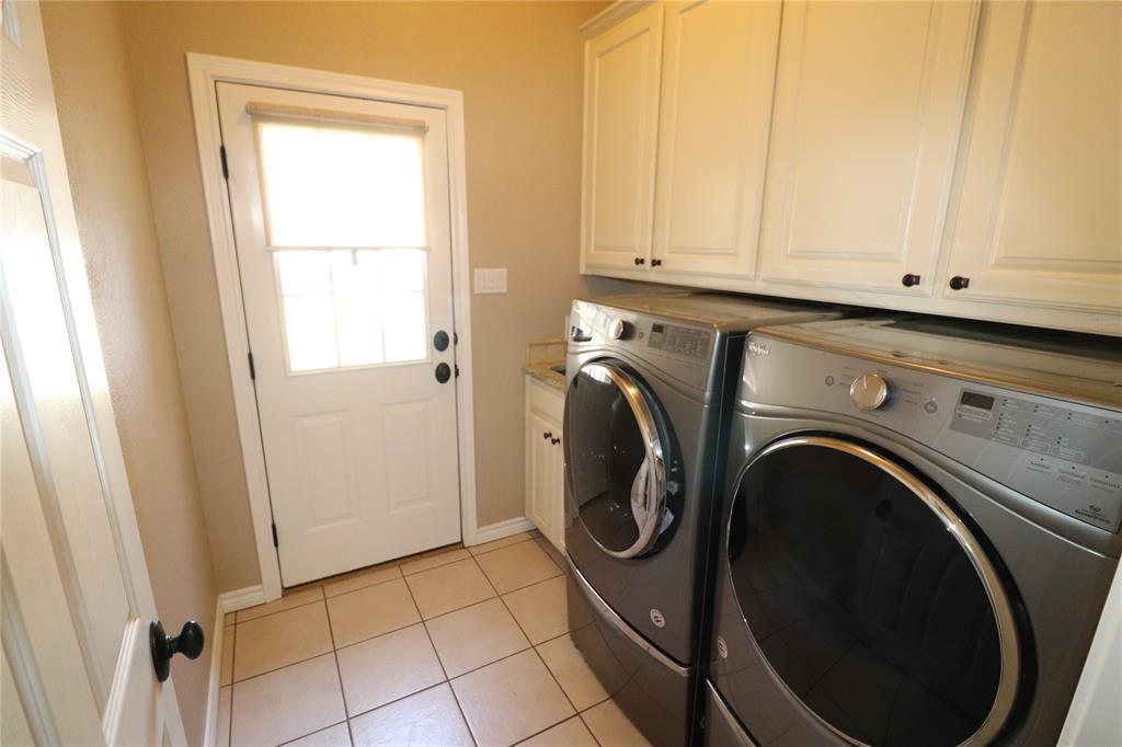 2642 Huddleston Road Sunset, TX 76270 - Photo 29 of 40 a utility room with dryer and washer