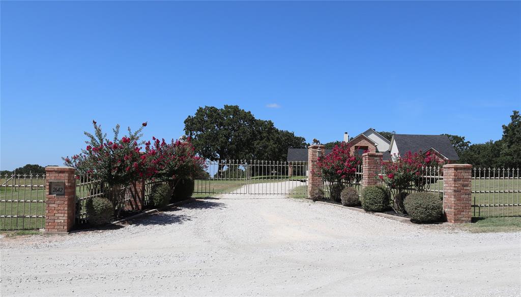 2642 Huddleston Road Sunset, TX 76270 - Photo 5 of 40 a view of a house with a snow in the background