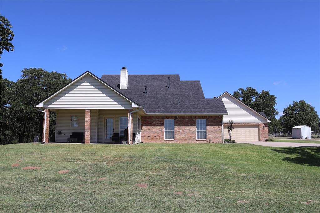 2642 Huddleston Road Sunset, TX 76270 - Photo 7 of 40 a view of a house with a yard