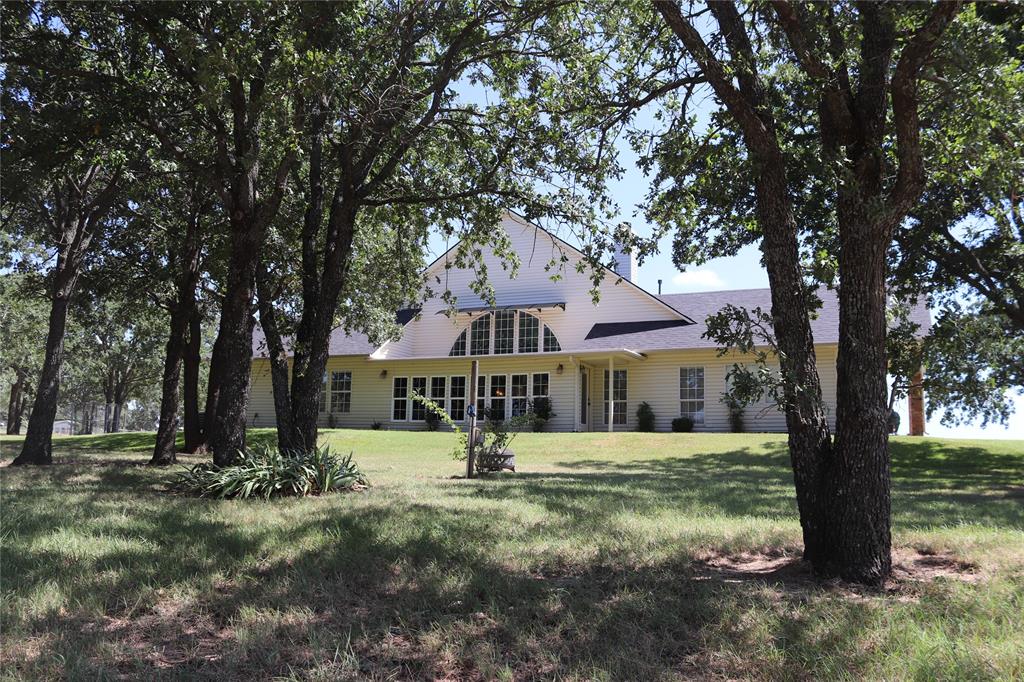 2642 Huddleston Road Sunset, TX 76270 - Photo 8 of 40 a front view of a house with a yard
