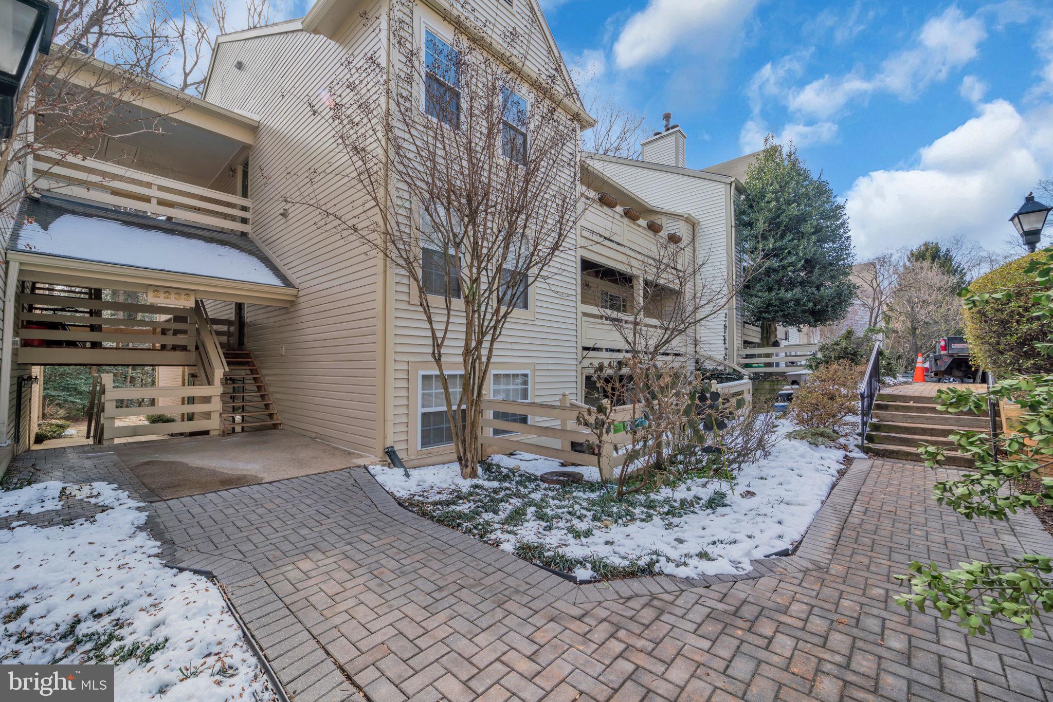 2233 Lovedale Lane, Unit L Reston, VA 20191 - Photo 1 of 18 a view of a house with a patio