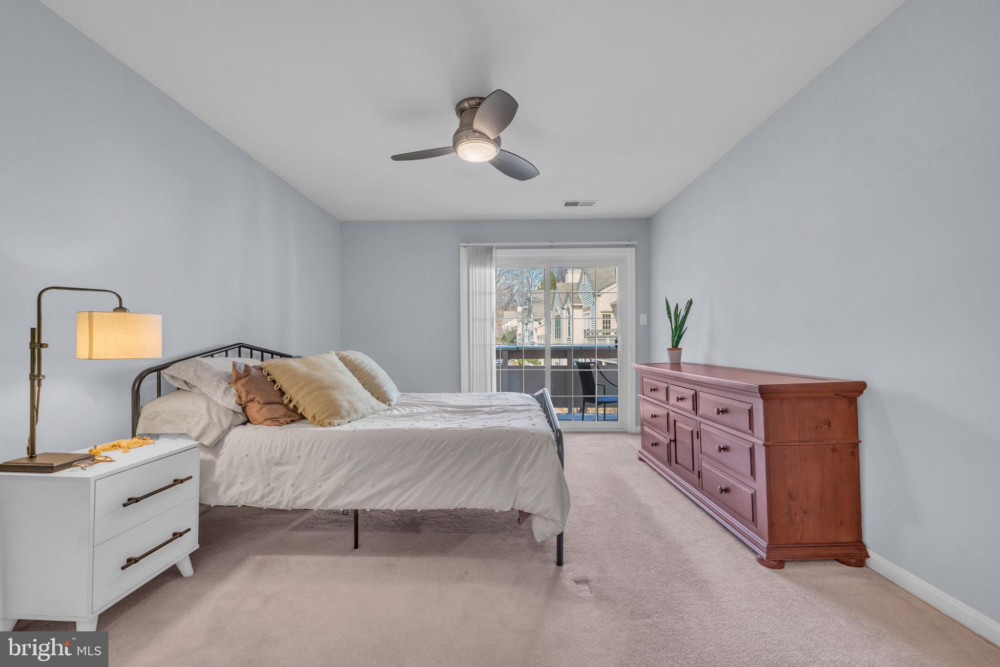 2233 Lovedale Lane, Unit L Reston, VA 20191 - Photo 11 of 18 a bedroom with furniture and windows