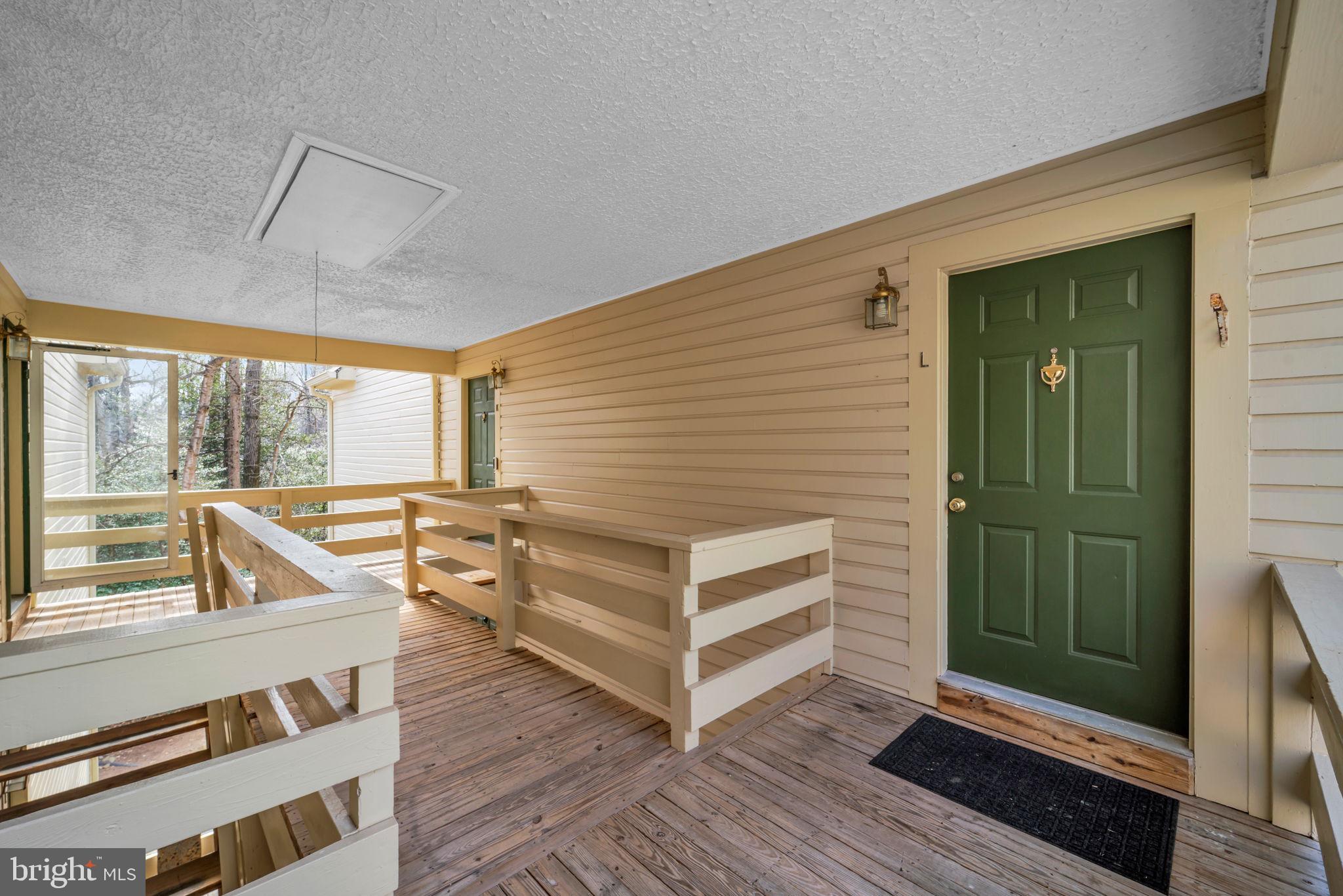 2233 Lovedale Lane, Unit L Reston, VA 20191 - Photo 3 of 18 a view of a room with wooden floor and windows
