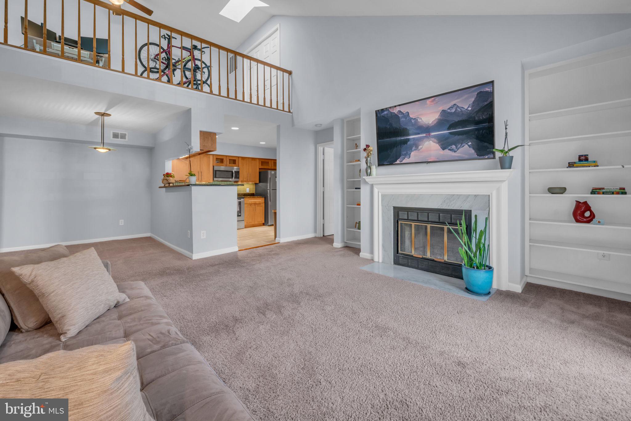 2233 Lovedale Lane, Unit L Reston, VA 20191 - Photo 4 of 18 a view of a livingroom with furniture and a fireplace