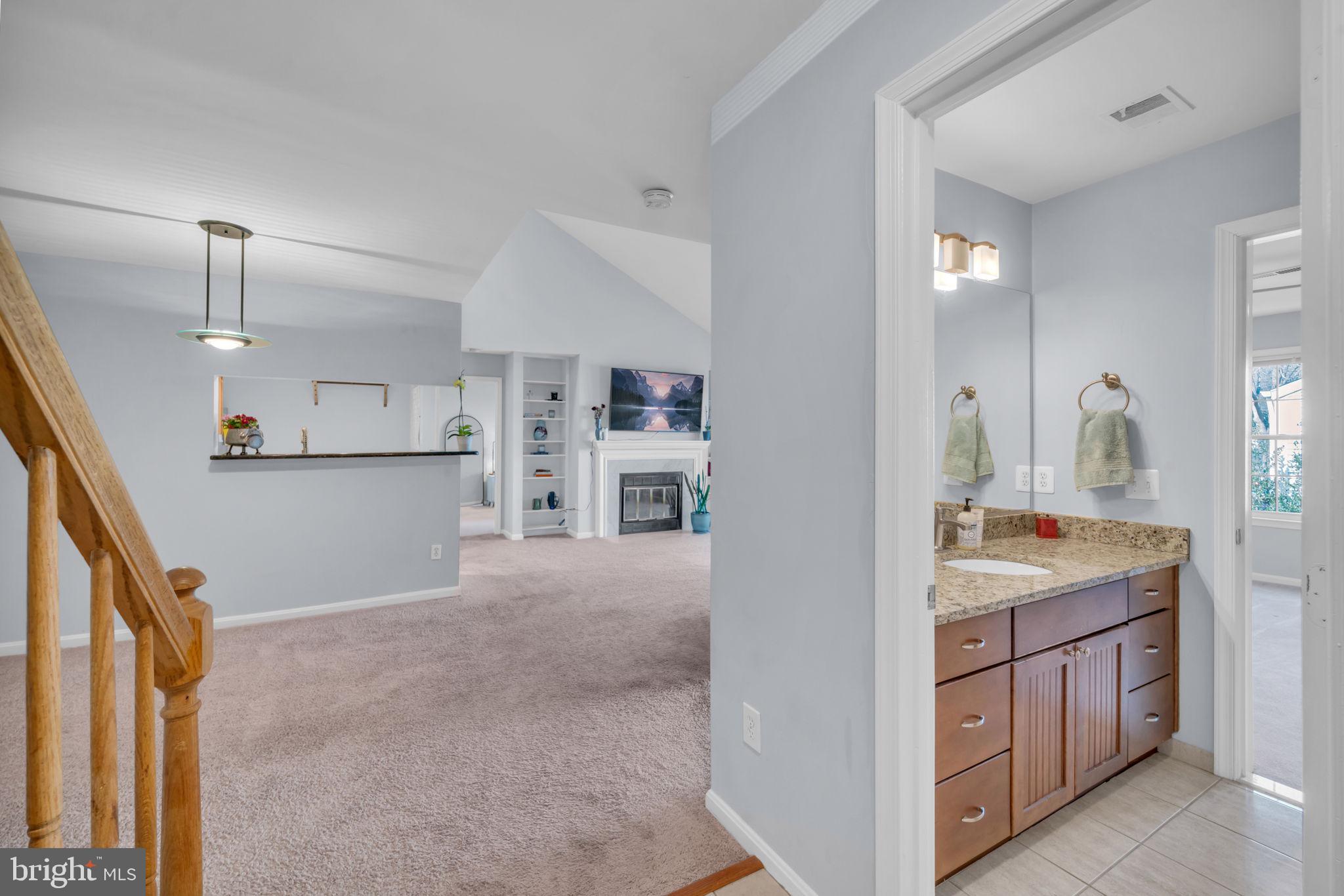 2233 Lovedale Lane, Unit L Reston, VA 20191 - Photo 5 of 18 a view of a kitchen cabinets and a living room