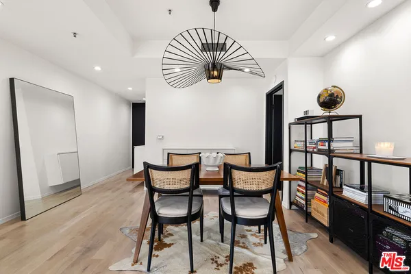 a view of a chairs and table in a room