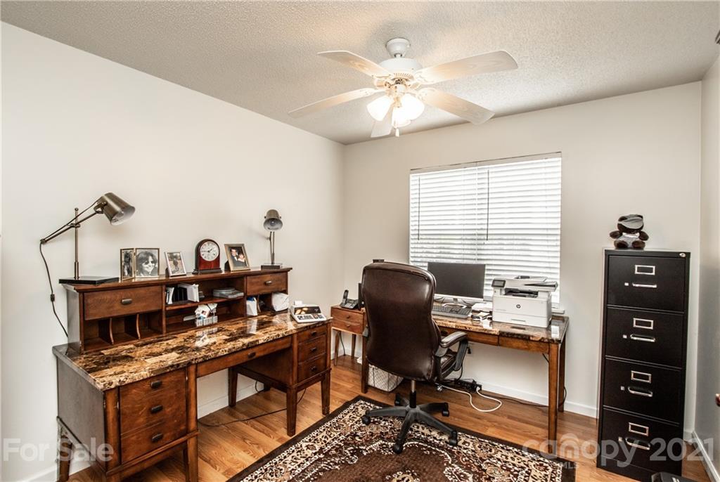 1360 Mistletoe Ridge Place Northwest Concord, NC 28027 - Photo 13 of 38 a view of a workspace with furniture and a window