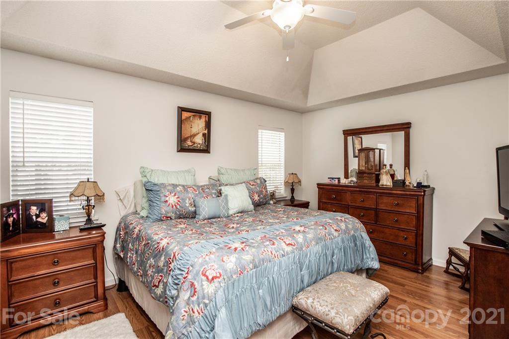 1360 Mistletoe Ridge Place Northwest Concord, NC 28027 - Photo 20 of 38 a bedroom with a bed and a dresser in it