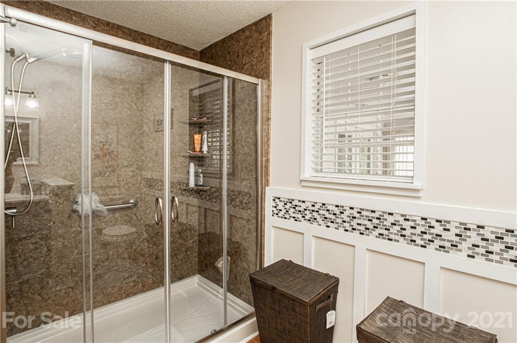 1360 Mistletoe Ridge Place Northwest Concord, NC 28027 - Photo 24 of 38 a bathroom with a sink and a mirror