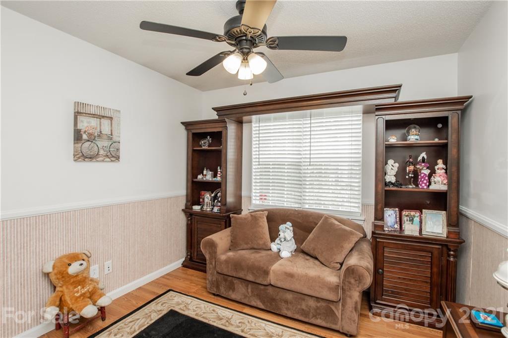 1360 Mistletoe Ridge Place Northwest Concord, NC 28027 - Photo 26 of 38 a living room with furniture and a window