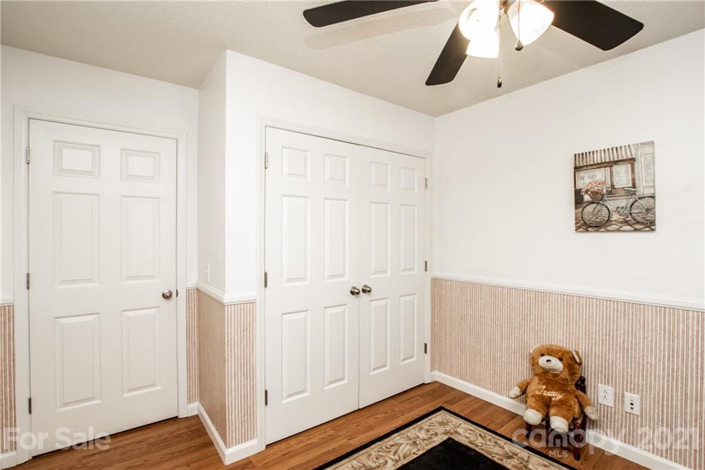 1360 Mistletoe Ridge Place Northwest Concord, NC 28027 - Photo 27 of 38 a view of a room with wooden floor