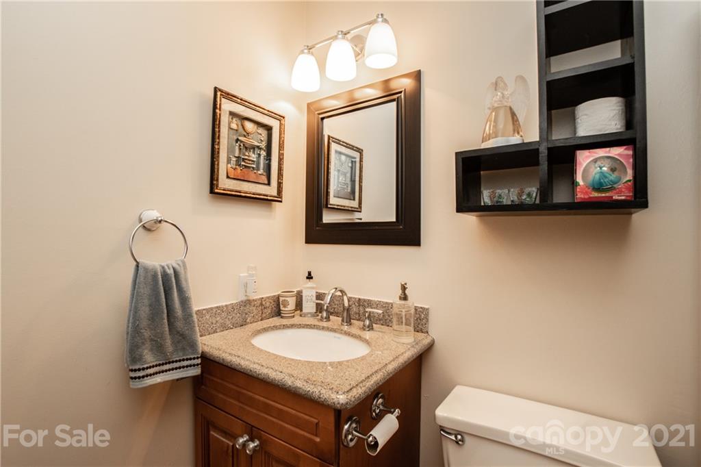 1360 Mistletoe Ridge Place Northwest Concord, NC 28027 - Photo 29 of 38 a bathroom with a sink and a toilet